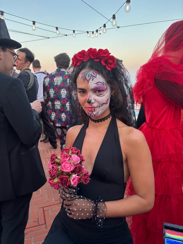 Day of the Dead face painting at a festival